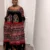 Cameroon women’s Toghu dress with red, green, yellow, and black embroidery – African cultural attire