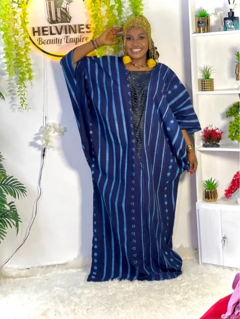 Cameroon women’s blue and black striped dress with circular embroidery – African cultural attire