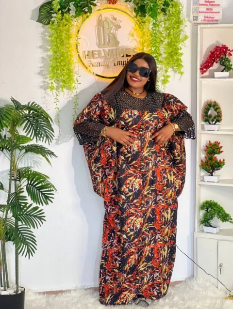 Cameroon women’s traditional outfit with red, yellow, and black patterns – African cultural attire