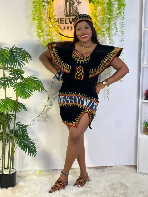 Cameroon men’s black traditional outfit with red, yellow, and white embroidery – African cultural attire