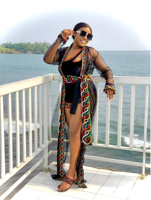 Cameroon women’s sheer black robe with red, yellow, and green chain patterns – African cultural attire